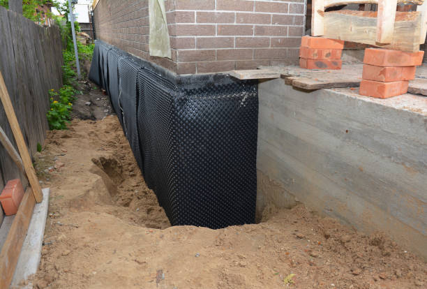 Happy homeowners after waterproofing job in Lake